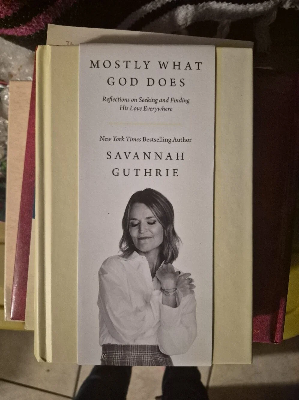 Mostly What God Does by — Cream Hardcover Coffee Table Book